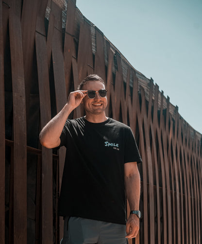 Dj Dan Sterry in Ibiza wearing Hun Sauce, Smile High Club Definition T-Shirt in black